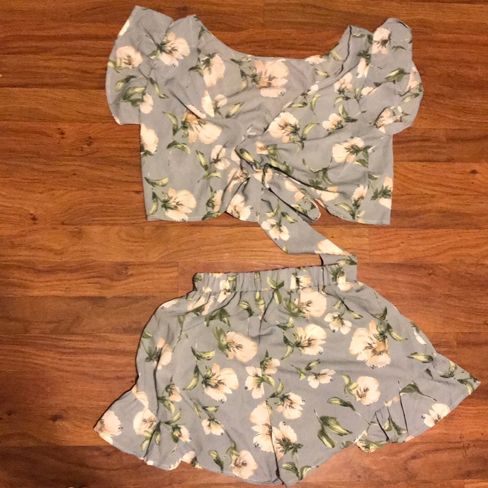 Cute crop top and high waisted bottom .